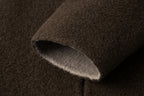 Close-up of the coat's sleeve opening and lighter inner face.