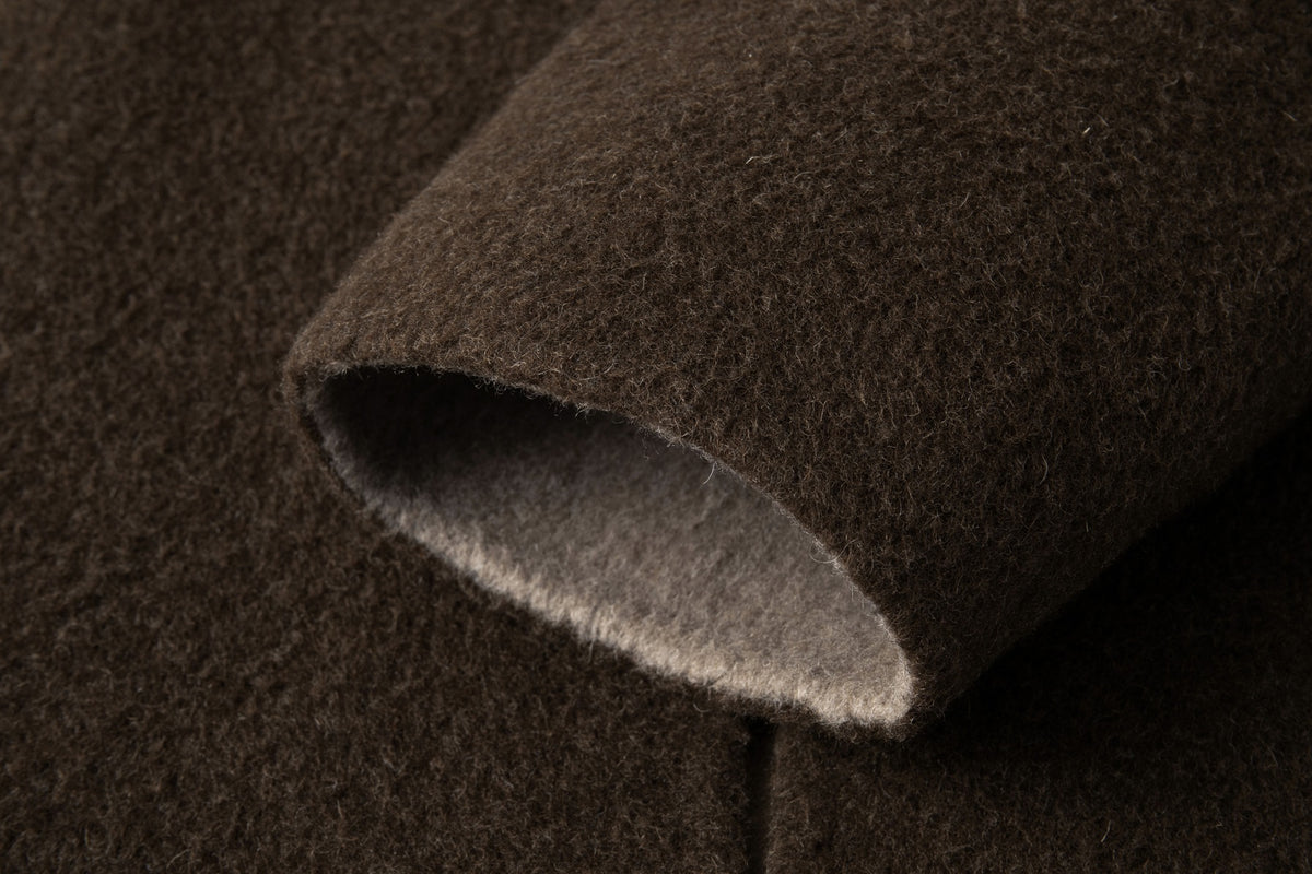 Close-up of the coat's sleeve opening and lighter inner face.