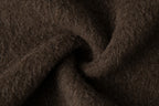 Close-up of the dark brown fabric showing its fine raised fibres.