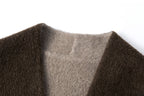 Close-up of the collarless neckline and contrasting lighter inner face.