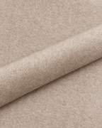 Almond wool fabric detail with a diagonal fold; colour-adjusted image.