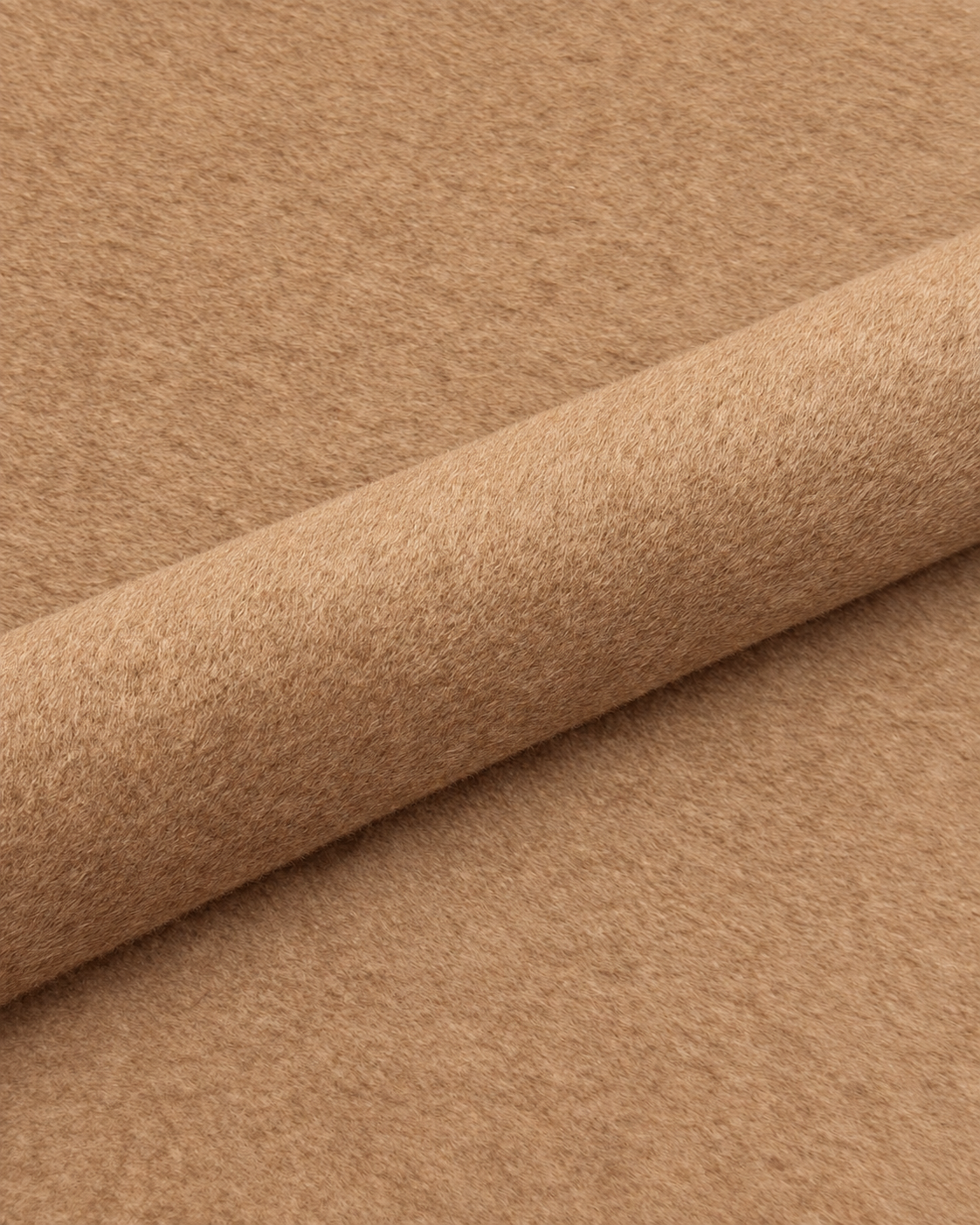 Desert gold wool fabric detail with a diagonal fold; colour-adjusted image.