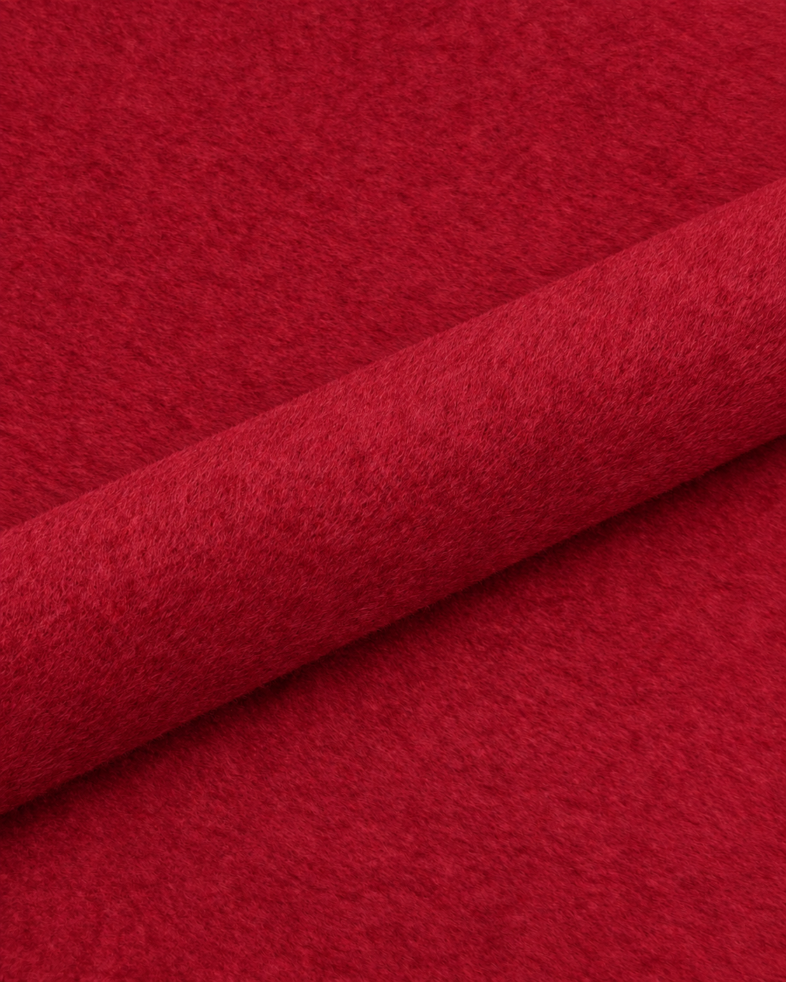 Ruby red wool fabric detail with a diagonal fold; colour-adjusted image.