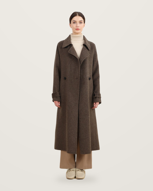 Coffee-coloured coat with cuff tabs, worn with a cream roll-neck and taupe trousers.