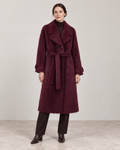 The Kensington plush coat in Plum, showing the notched lapels, self-fabric belt and cuff tabs.