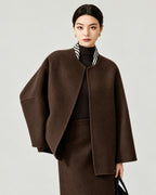 AI-assisted styling of THE LANE 007 Coffee pure wool oversized short coat, round neckline, dropped shoulders, wide sleeves and no patch pockets. Front styling view.