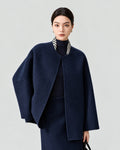 AI-assisted styling of THE LANE 007 Navy pure wool oversized short coat, round neckline, dropped shoulders and wide sleeves. Front styling view.