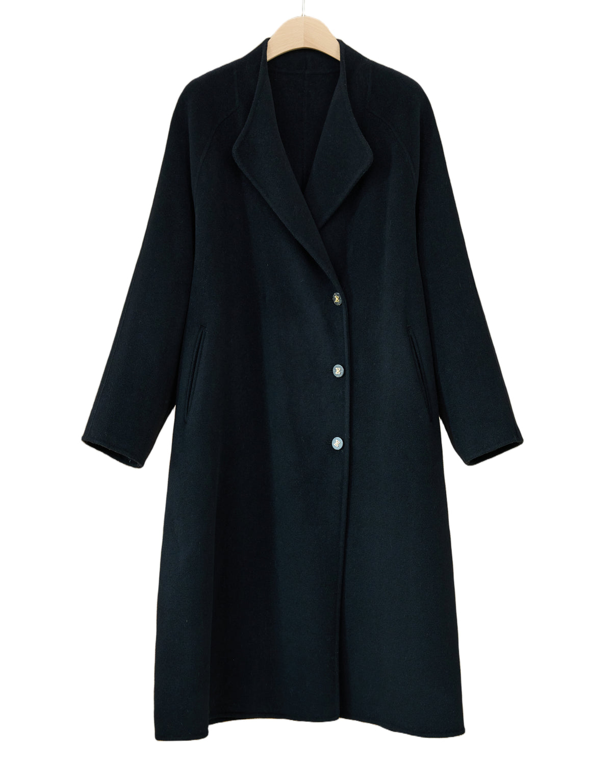 066 Black cashmere and wool blend long coat, front view with curved lapels and a single-breasted button front.