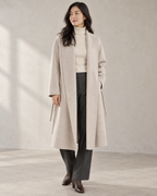 Vienna coat in Oats, open front model view with long shawl collar facings and unfastened drawcord — AI-assisted styling image.