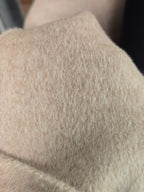 Close-up of the Vienna coat fabric showing fine brushed fibres and soft surface nap — original photograph.