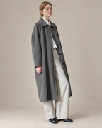 Dark Grey Richmond cotton-Tencel trench coat, AI-assisted adaptation of the original model photograph to a warm neutral studio.