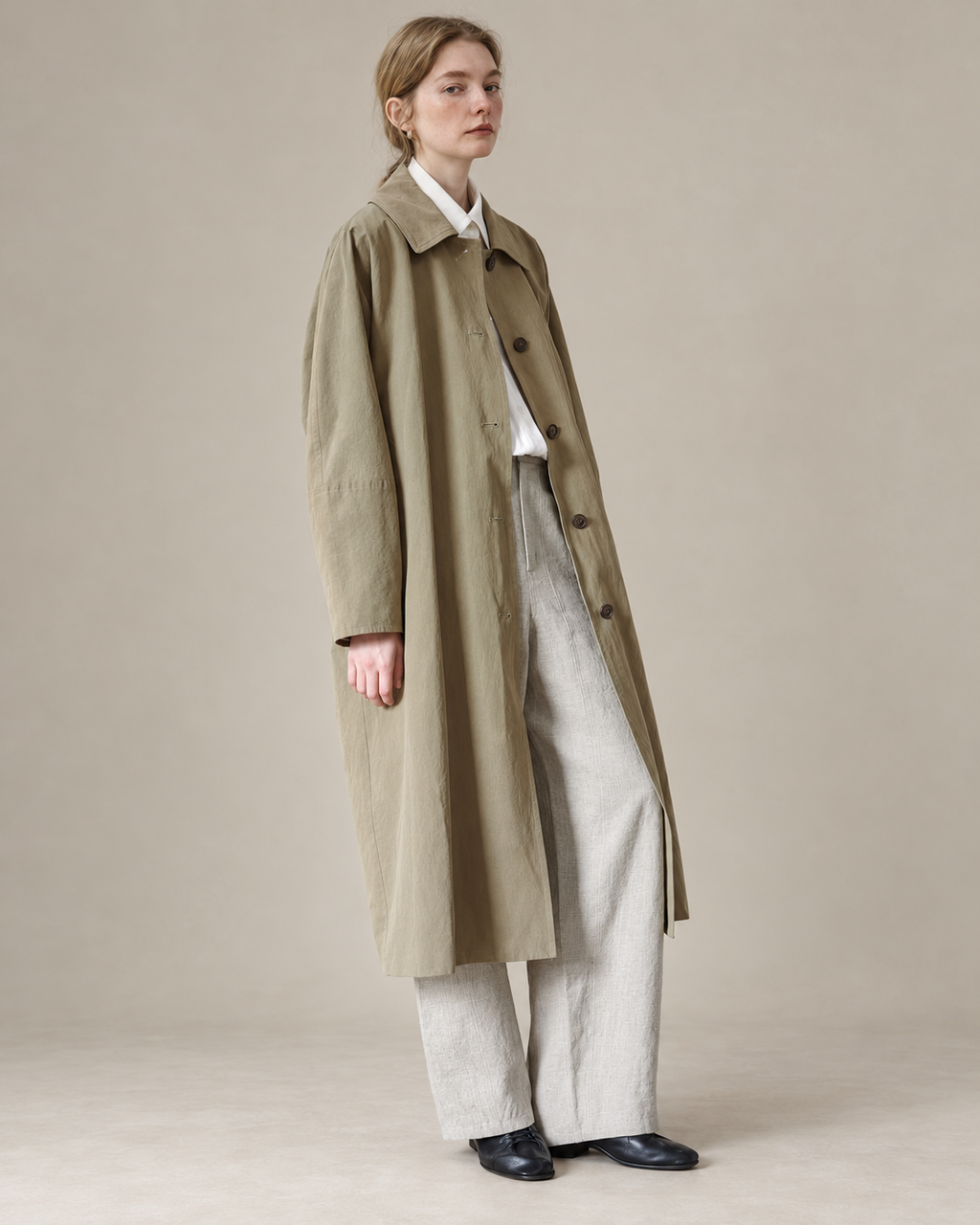 Coffee Green Richmond trench coat, studio background adapted from the original model photograph.