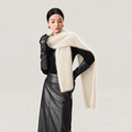 Ivory cashmere and wool-blend scarf worn wrapped around the shoulders